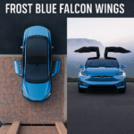 A high-resolution digital photograph of a Tesla Model X in a stunning Frost Blue color, showcasing its iconic Falcon Wing doors open upward in a futuristic style. The vehicle is parked on a clean, modern road with a snowy Arctic-inspired background, emphasizing the "cool" and "innovative" branding.