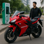 Okaya Ferrato Disruptor electric sports bike with LED headlamp and aerodynamic design parked near EV charging station in Indian cityscape with young rider